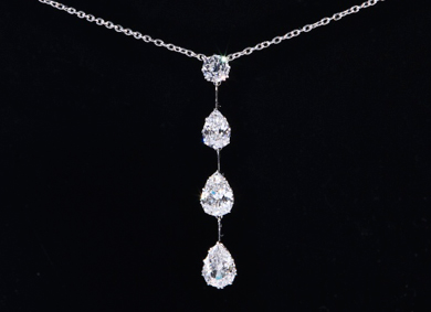 A diamond four stone drop pendant, 5.5ct total - Sold for €15,000