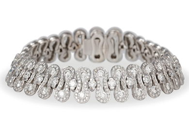 A diamond and fancy - link 'Wave' bracelet by Waskoll, Paris, 12.50ct total - Sold for €8,500