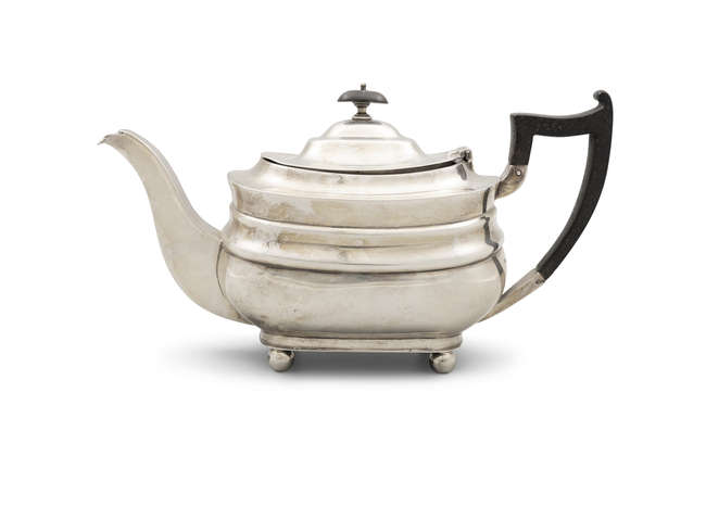A SILVER TEAPOT

Sheffield c.1931, mark of James..., Fine Irish Art at Adams Auctioneers